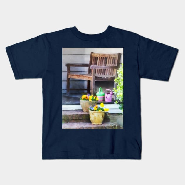 Suburbs - Pansies and Watering Cans on Steps Kids T-Shirt by SusanSavad